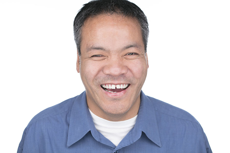 Jennison Asuncion smiling broadly.