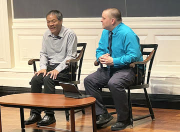 Jennison and Kyle in conversation on stage.